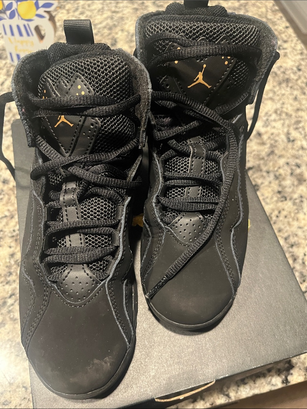 Kids Jordan Black with Gold Accent High-Top Sneakers